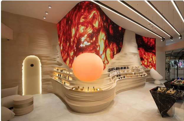 A room with a large orange ball on the wall
Description automatically generated