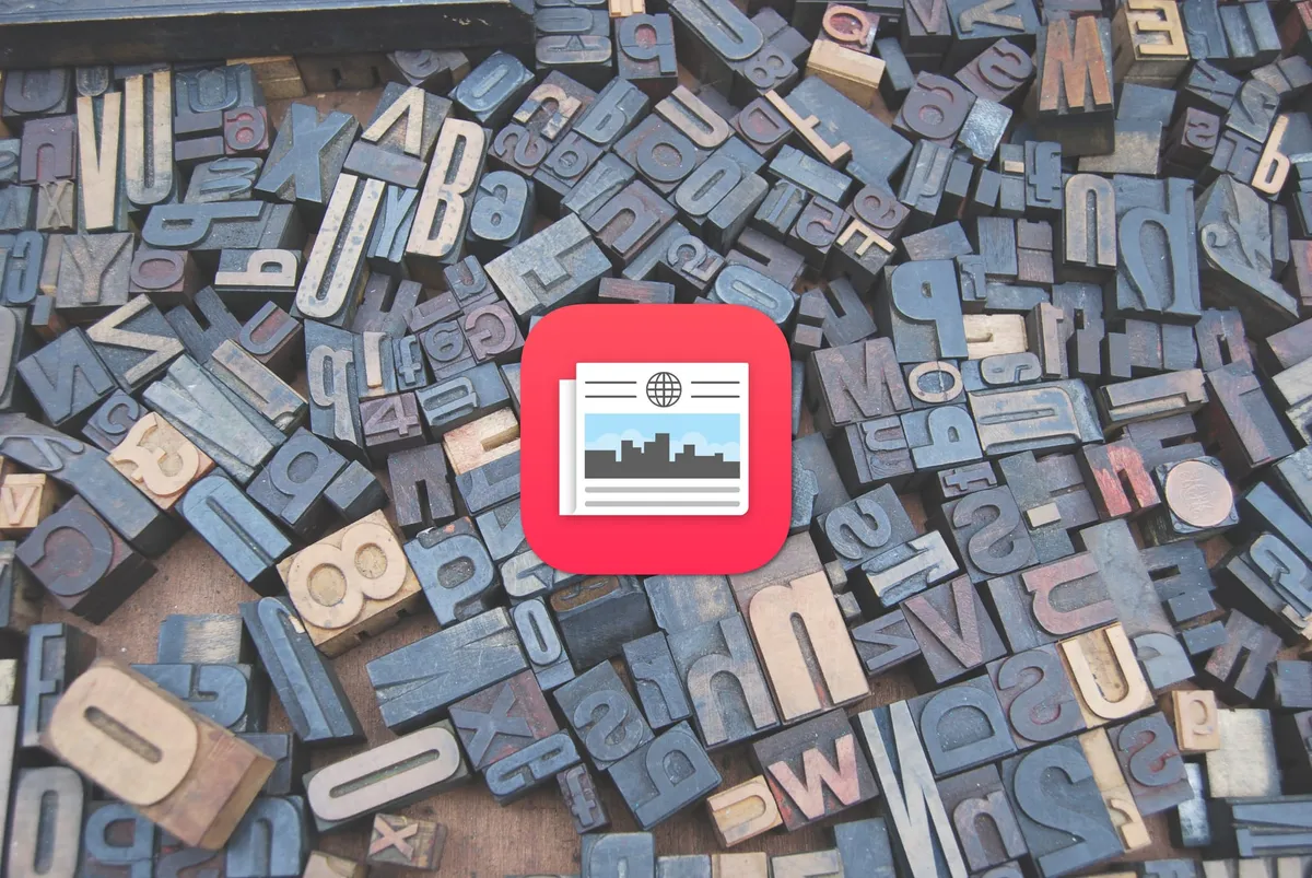 The Apple News app icon in front of typesetting letters.