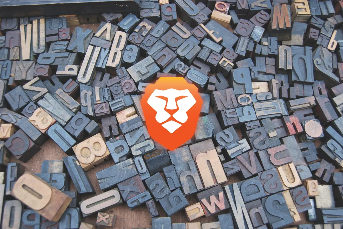 The Brave logo in front of a scattered letterpress set.