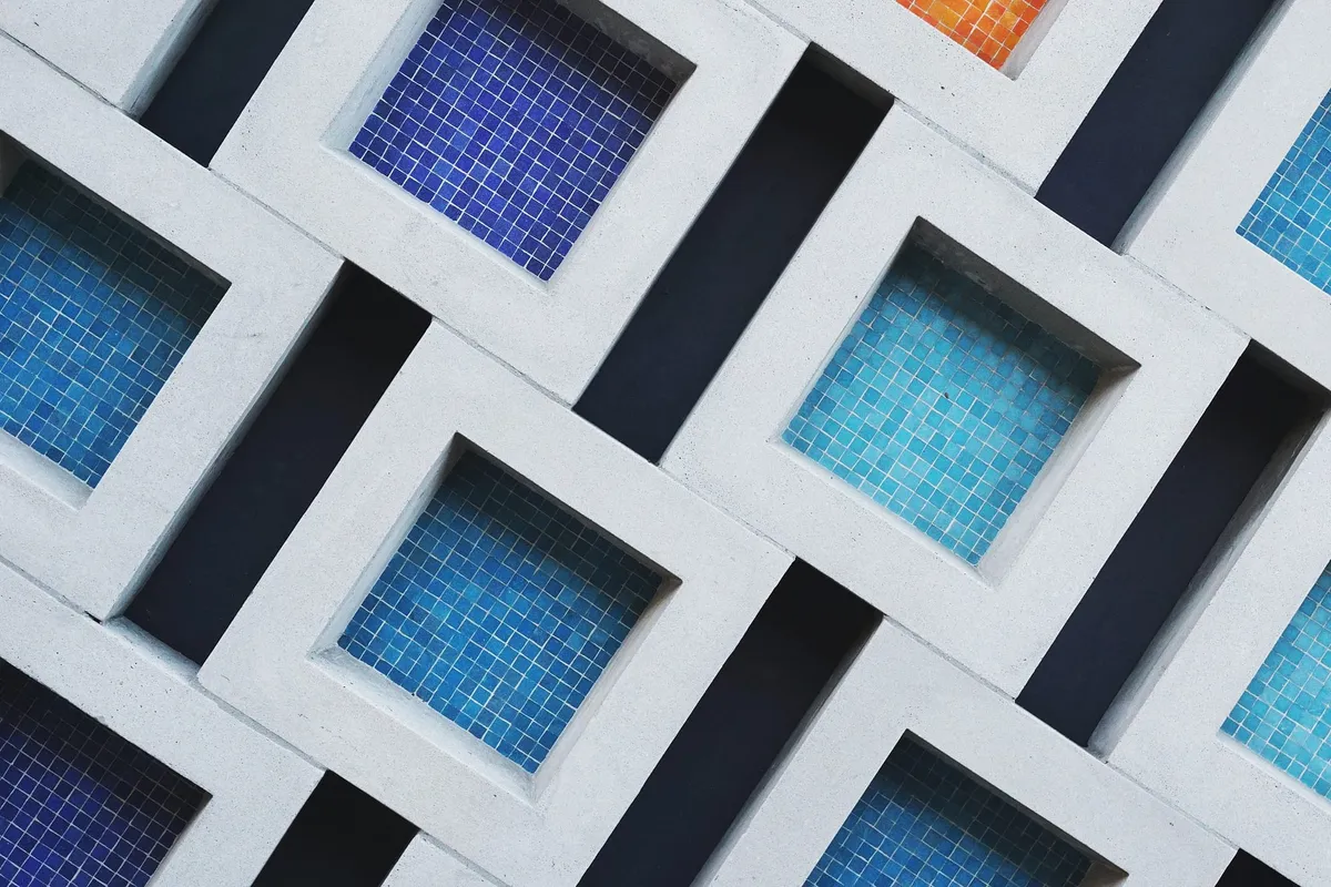 A set of concrete squares with colored titles inside.