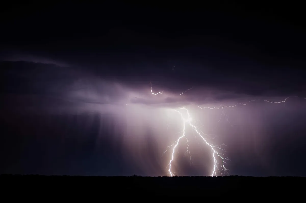 A lightning strike and heavy rain.