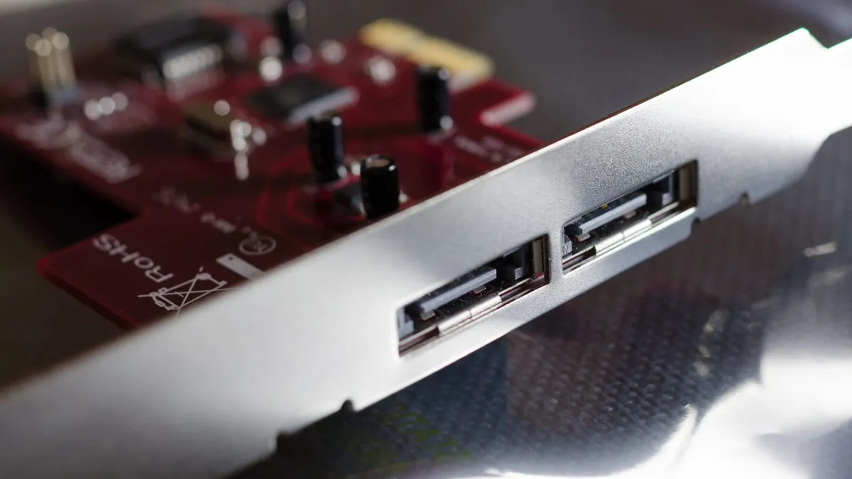 A close-up of two external eSATA ports and the shield of a PCIe card.