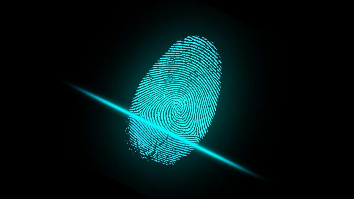 A blue beam of light scans a fingerprint.