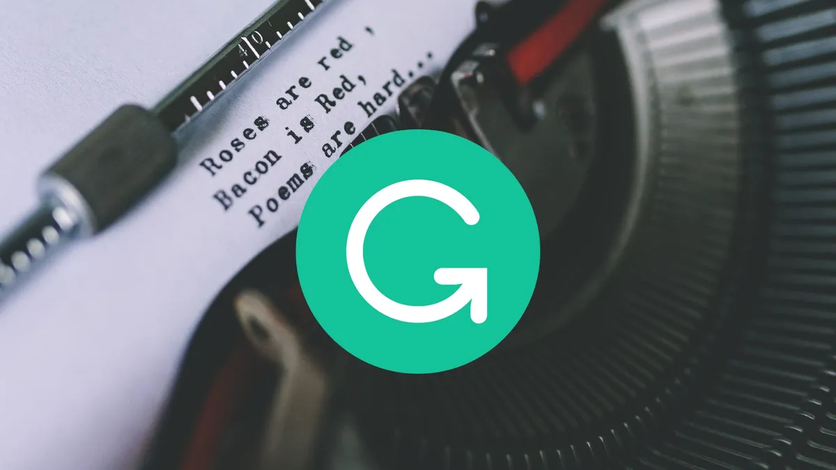 The Grammarly logo in the foreground with a photo of a typewriter with an odd little poem in the background.
