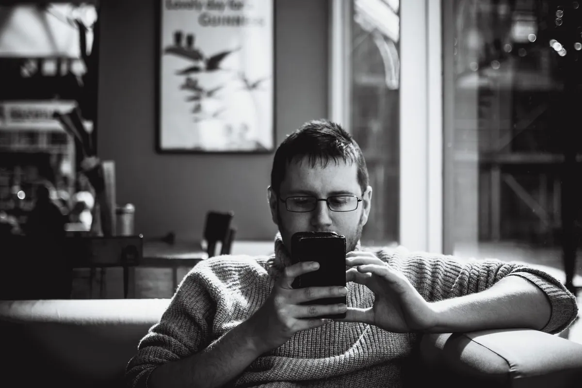 Man reading on his phone.