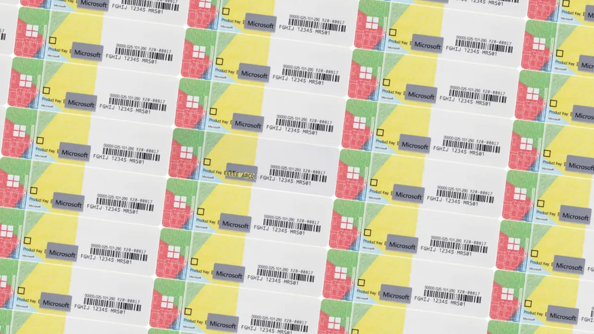 A sheet with Windows product license-key stickers.