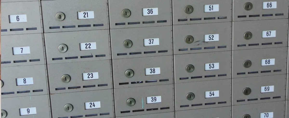 A wall of numbered locked boxes.