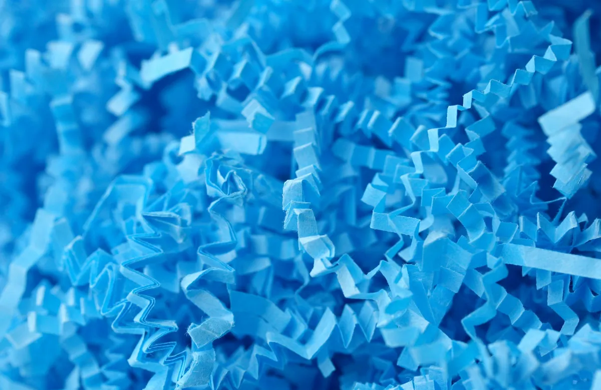 Shredded blue paper/destroyed documents.
