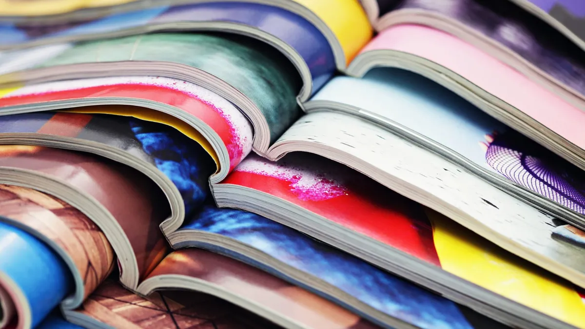 A stack of open magazines.