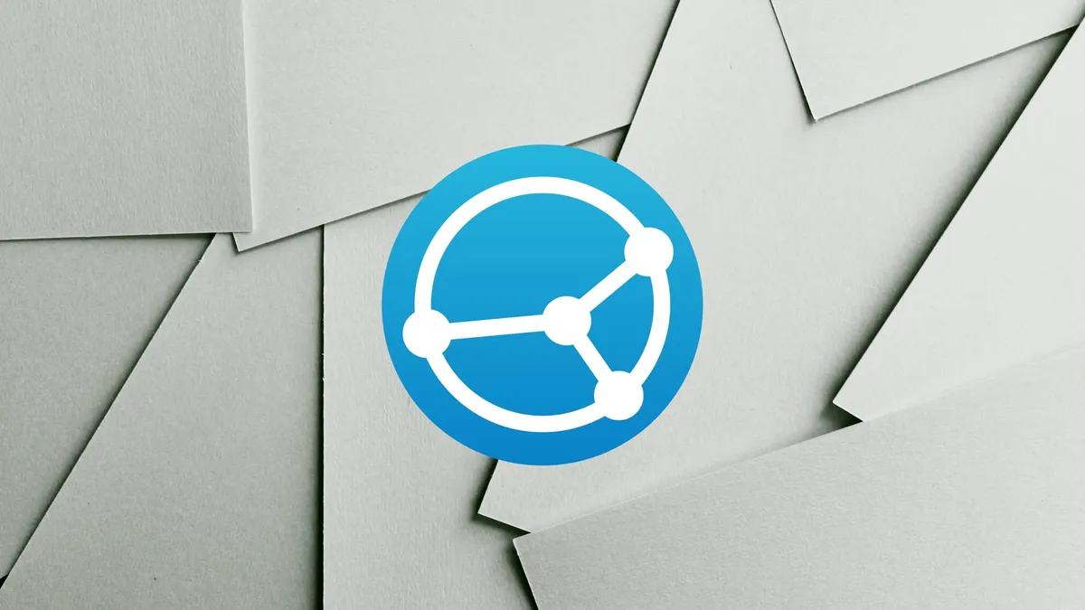 The Syncthing logo in front of some scattered white paper sheets.