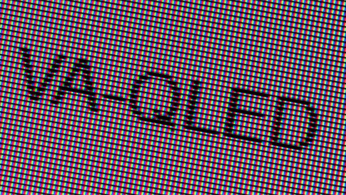 A close-up photo of the word “VA-QLED” on a VA-QLED display panel.