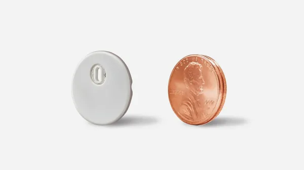 The FreeStyle Libre 3 is about the size of two stacked 1 USD cents (or 5 Euro cent) coins.