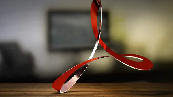 The swirling Adobe logo levitating over a table.