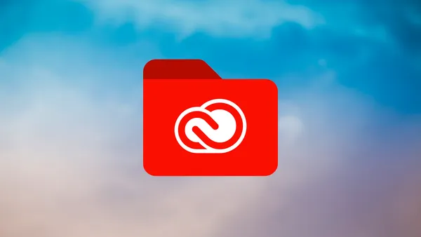 The Adobe Creative Cloud logo on a red folder icon set against a colorful sky.
