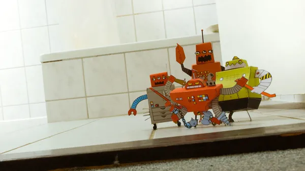 A mob of cardboard boxes made into tiny robots.