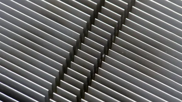 Abstract inspired by aluminum heatsink fins.