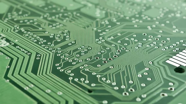 The backside of a green circutboard.
