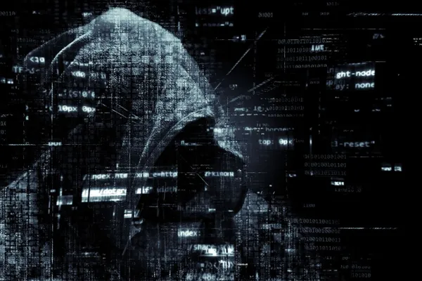 Nondistinct numbers, and digital noise and artifacts are shown in front of a dark hooded figure.
