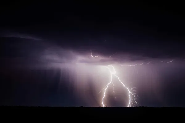 A lightning strike and heavy rain.
