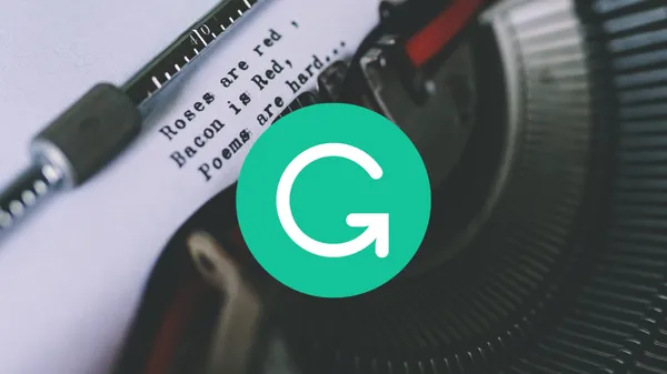 The Grammarly logo in the foreground with a photo of a typewriter with an odd little poem in the background.