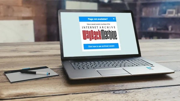 A laptop screen showing an info message about the page being unavailable on the web; but suggests looking for it in the Internet Archive.