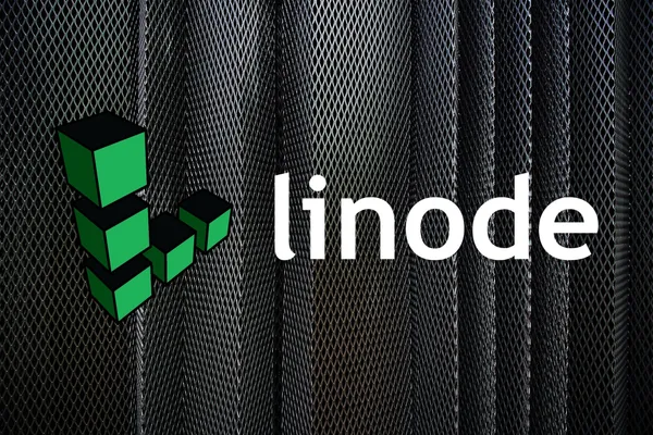 The Linode logo with some metal sheets in the background.