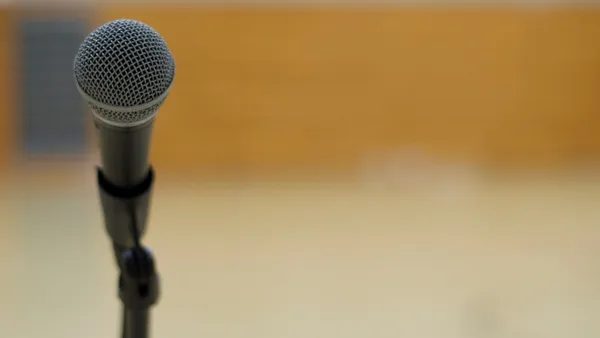 A microphone on a microphone stand.