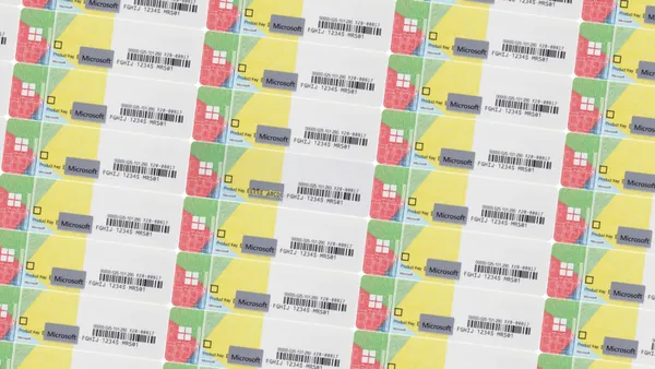 A sheet with Windows product license-key stickers.