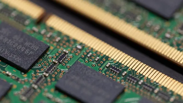 A close-up look of two sticks of computer RAM.