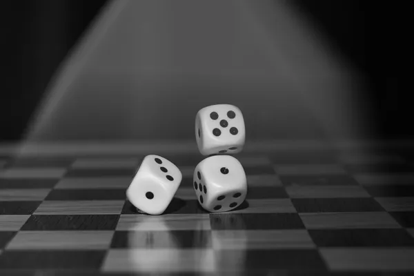 Rolling dice.