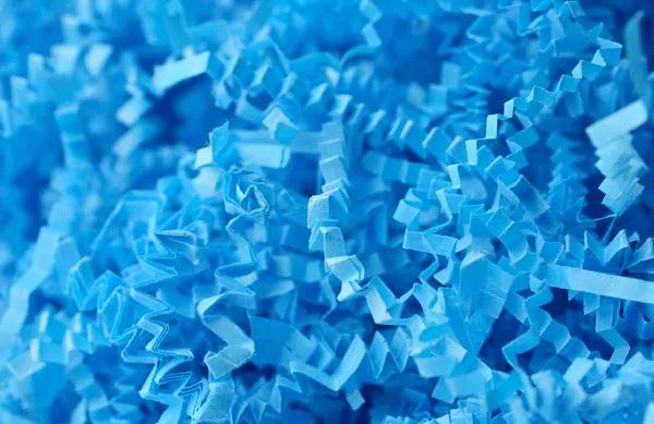 Shredded blue paper/destroyed documents.