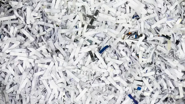 A pile of shredded blue paper.