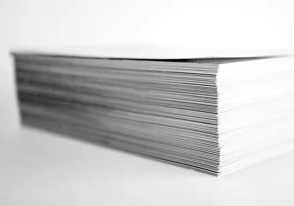 A stack of white paper sheets.
