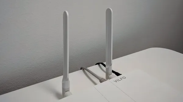 A close-up of the Wi-Fi antennas sticking up behind the Vilfo VPN router.