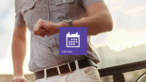 The Outlook Calendar app tile in front with a man checking the time on his wristwatch in the background.