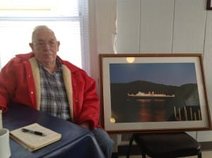 Ford Forrester with the photograph his son Stanley took for the City of Milwaukee, just before she shipped out of Elberta's harbor for the last time.