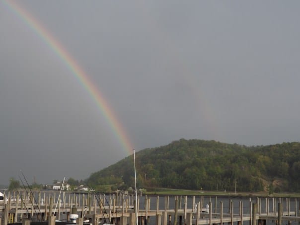 We may not have a literal pot of gold, but on nights like these, soft rain under sunshine making a full-on 180-degree rainbow, we sure do feel lucky. Thanks, Marilyn Maslo, for capturing the moment.