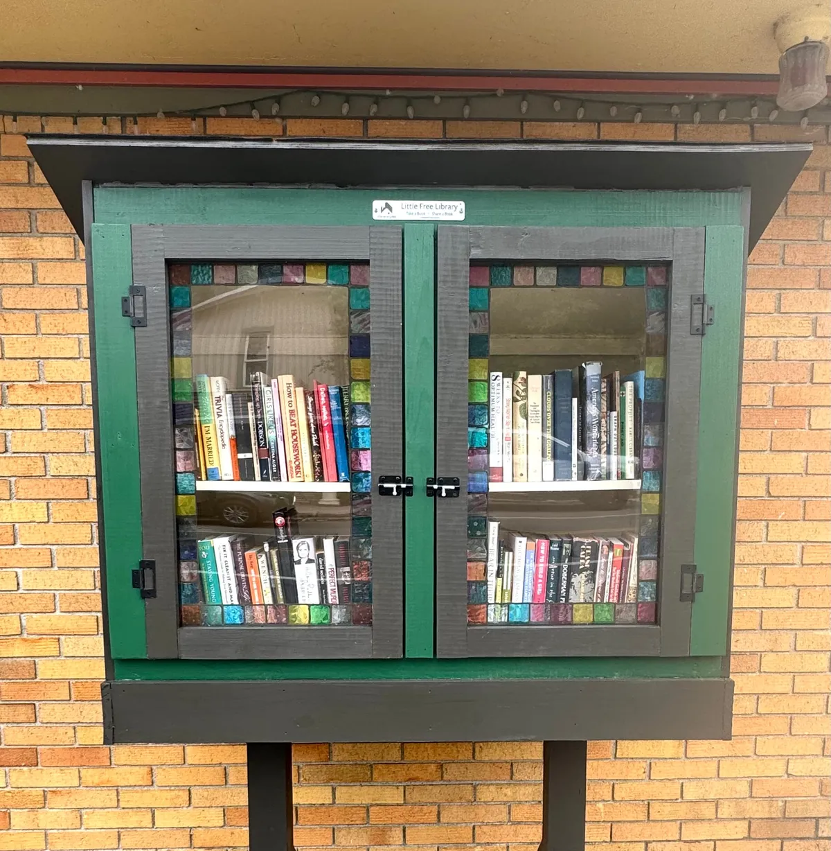 New Little Free Library Opens in Village, and Rubberman Kicks Off