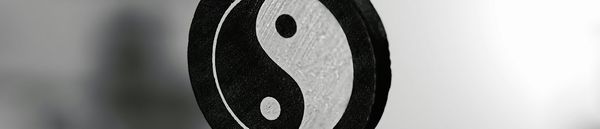 Standing with Hands on the Heads of Two Tigers