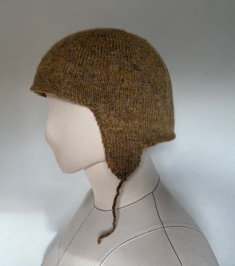 A knit coif cap