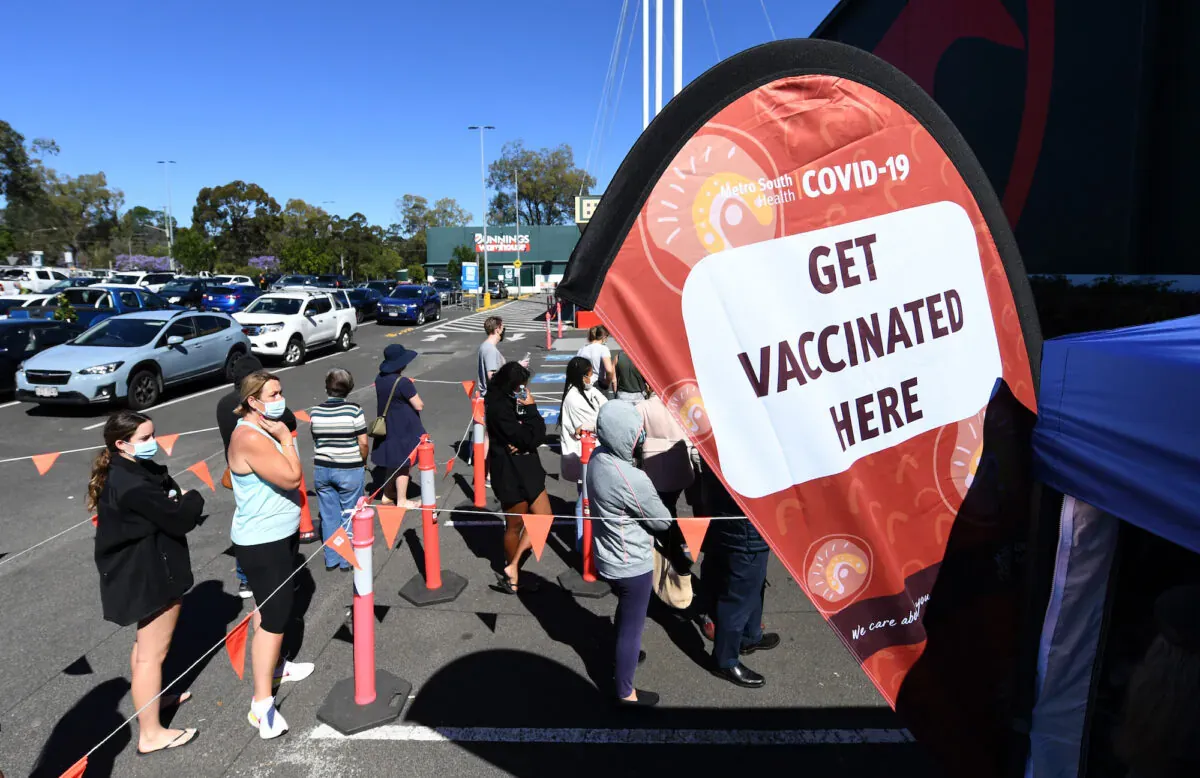 People queue to receive a Covid-19 vaccine at a Bunnings hardware store in Brisbane, Australia, on Oct. 16, 2021. (Dan Peled/Getty Images)