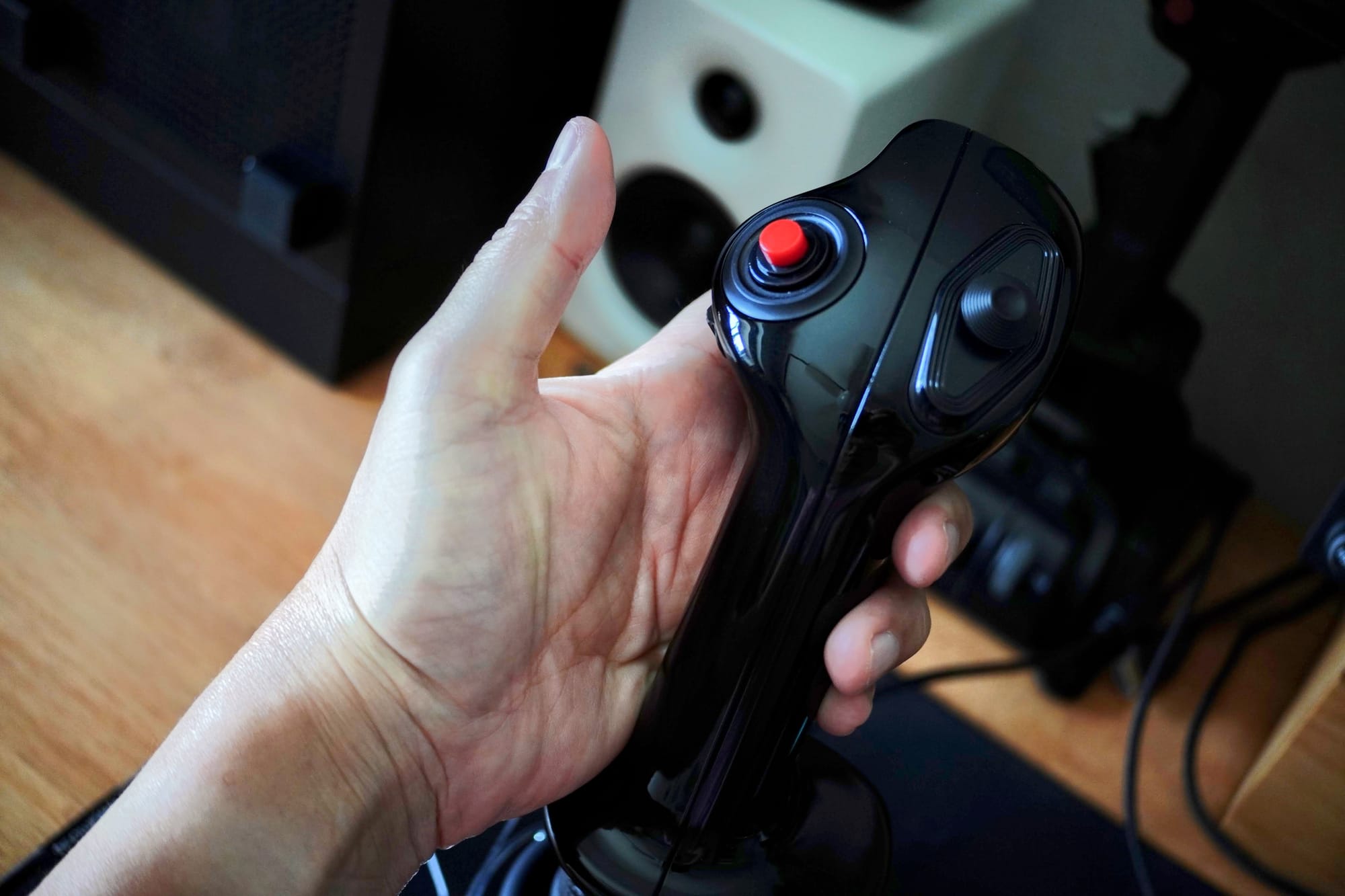 MOZA MA3X mounted on a desk — showing compact footprint and side-stick positioning for left-hand operation