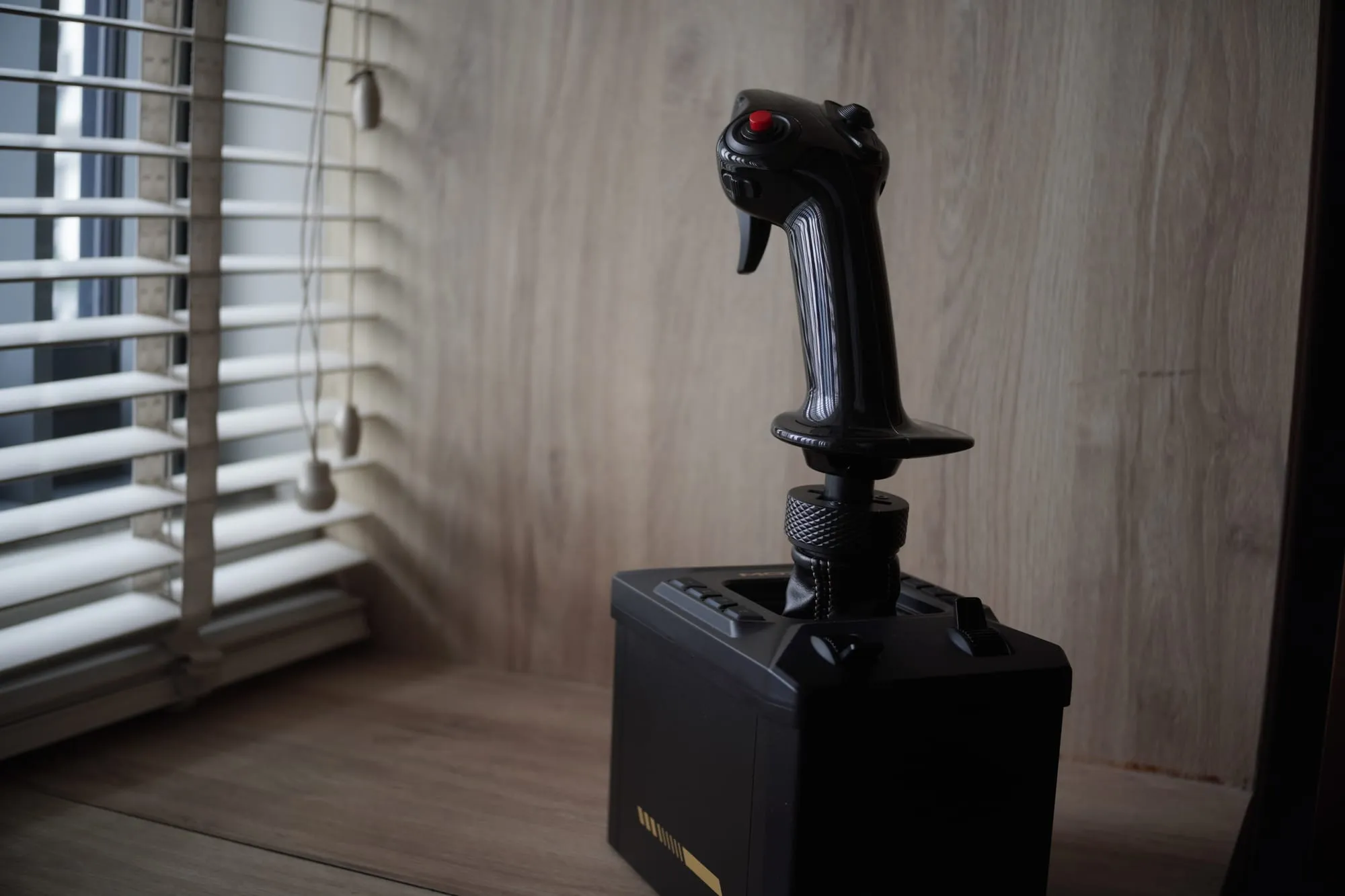 Side view of the AB6 with the grip's knurled locking collar visible above the base's button panel