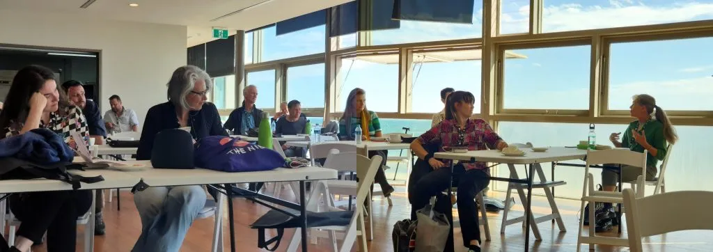 Photo of people seated and listening at the 2023 Stanleys conference in St Kilda.