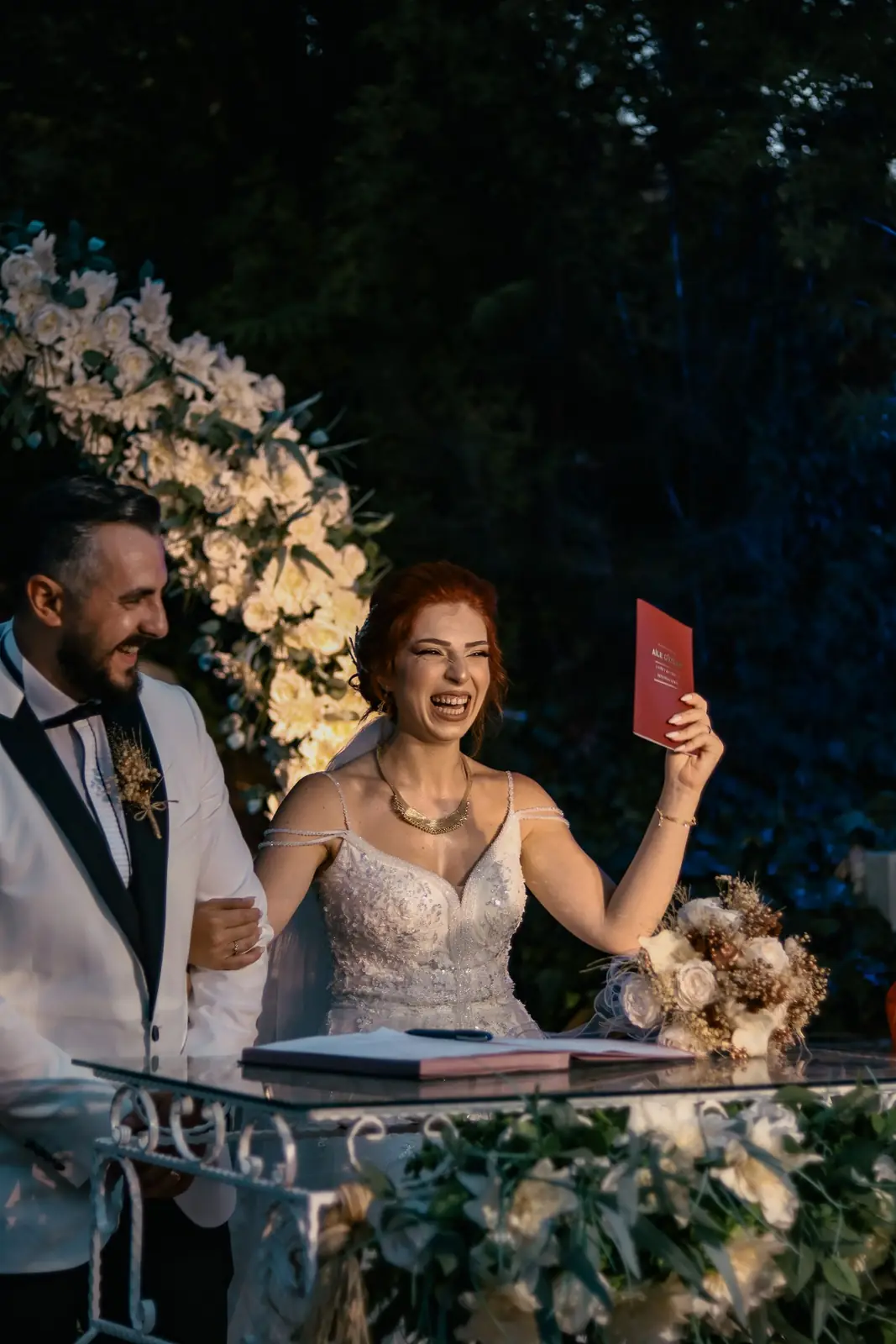 Happy couple exchanging vows at an elegant outdoor wedding ceremony.