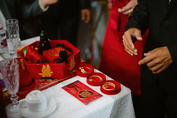 Red gift boxes and gold jewelry at a Vietnamese wedding ceremony in Ho Chi Minh City.