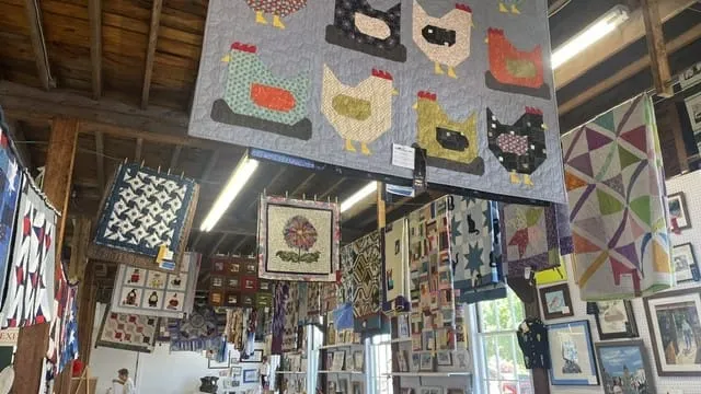 Display of quilts at Marshfield Fair -photo by Anne Stanton