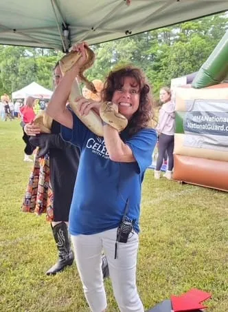 Kathleen Keegan with a Boa Constrictor - photo by Jennifer Leonard