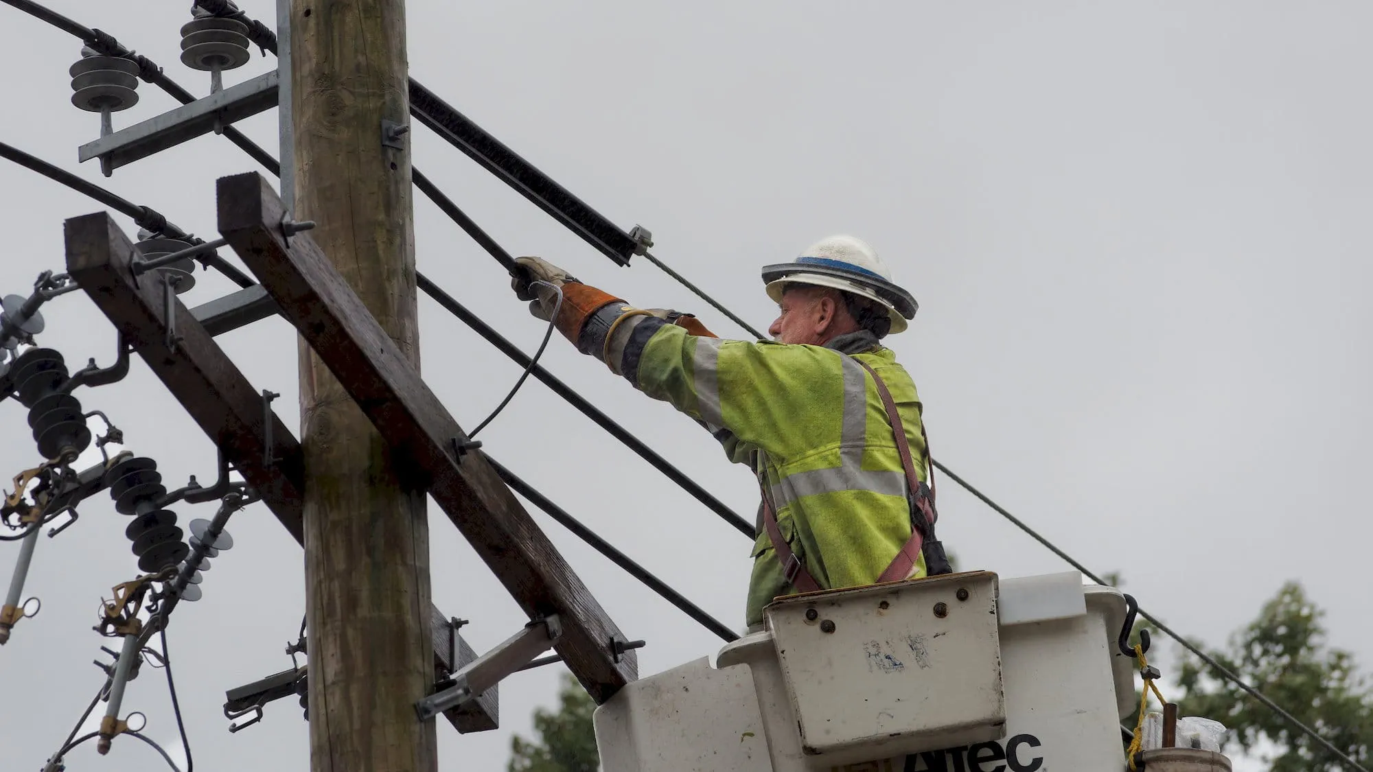 National Grid crews disconnecting the live wires. Photo by Will Tavares