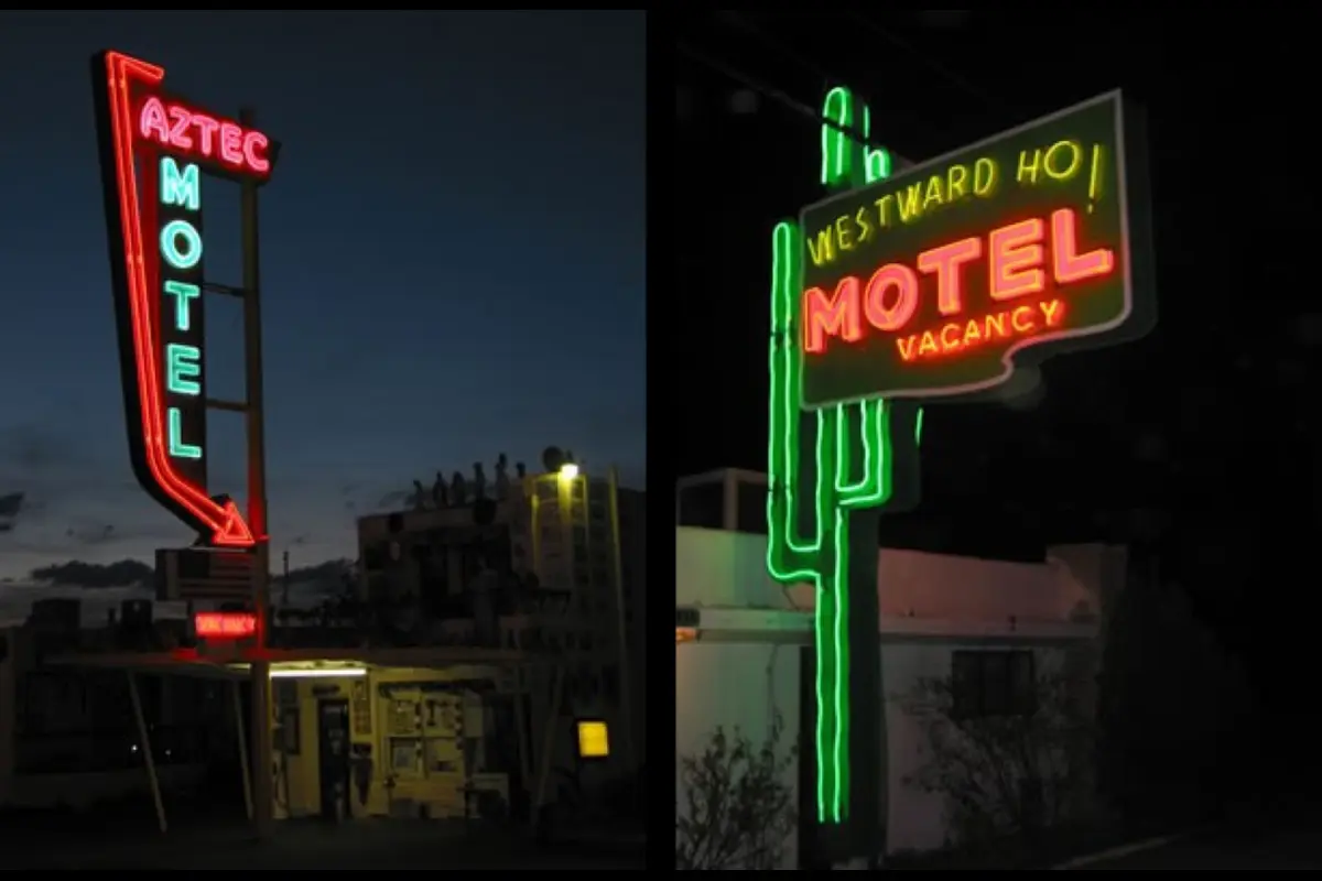 Historic Route 66 sign along a desert road in the USA.